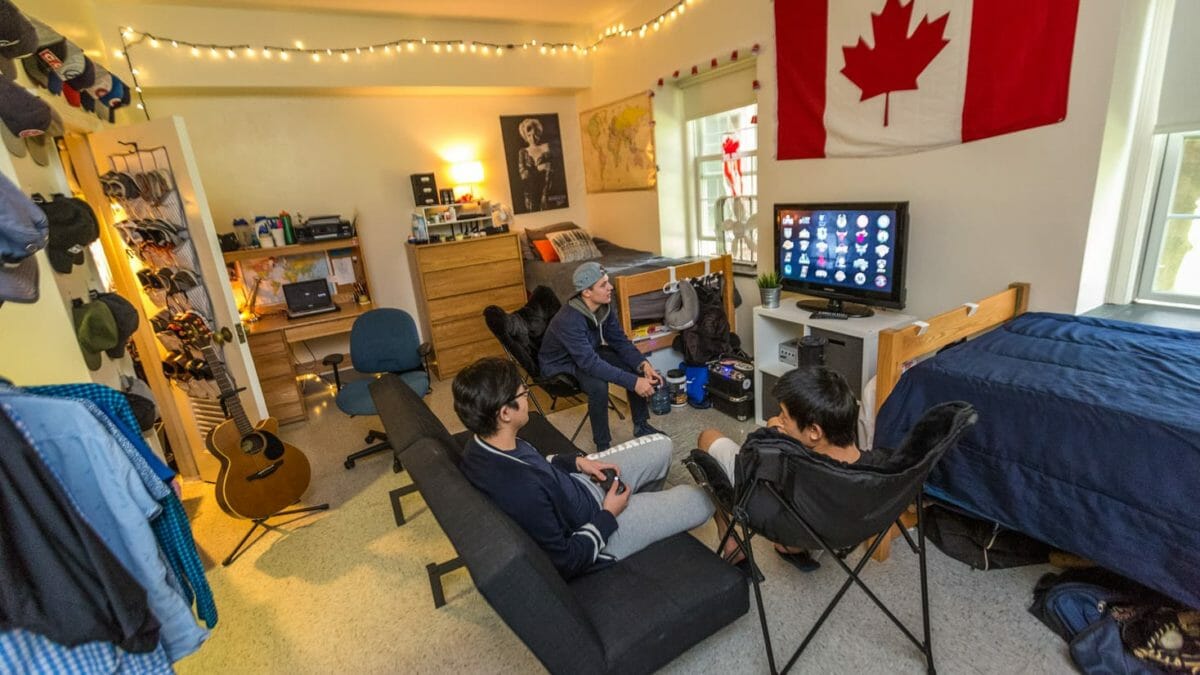 Students playing video games in dorm